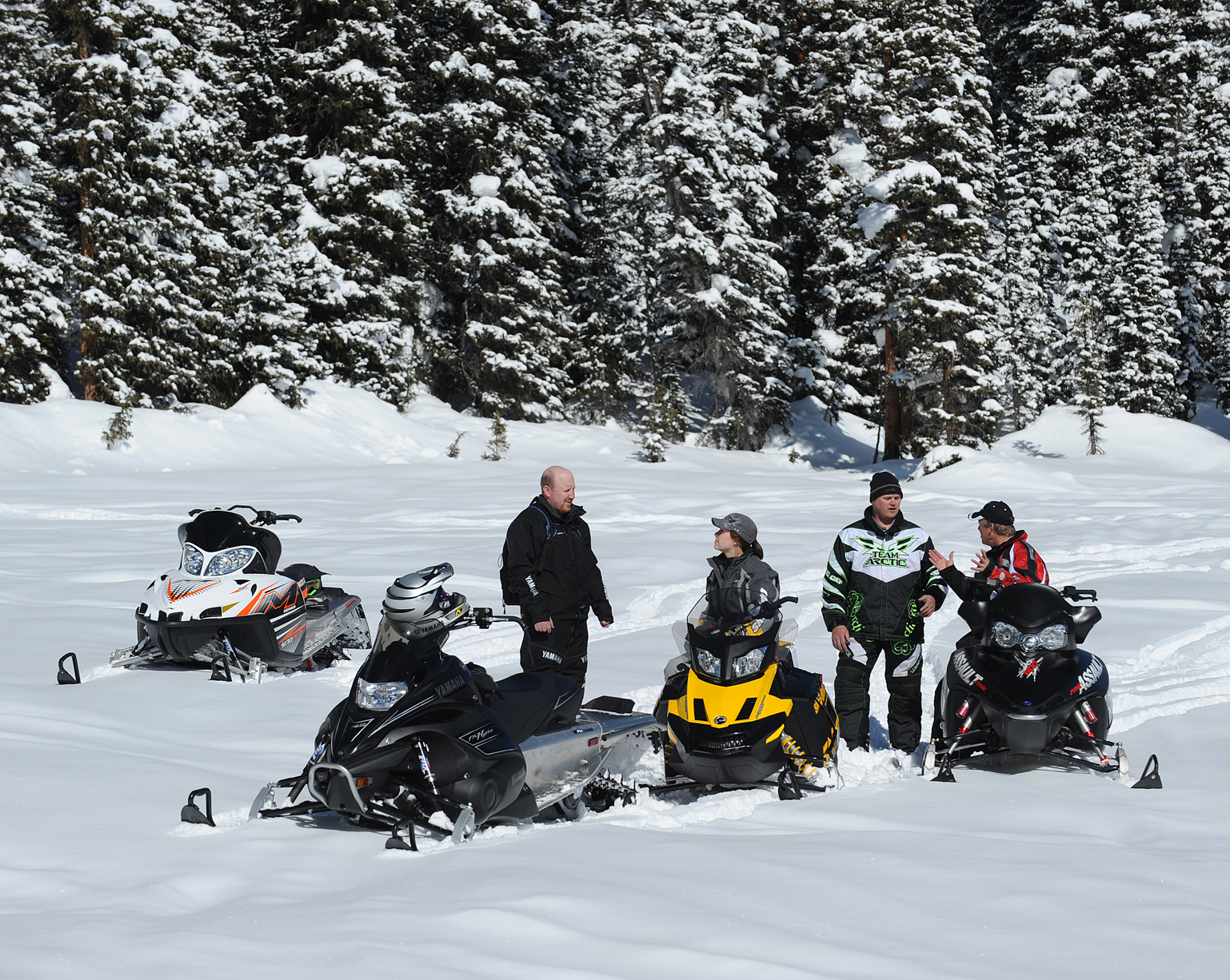 Photos of snowmobilers riding in groups, ISMA (International Snowmobile