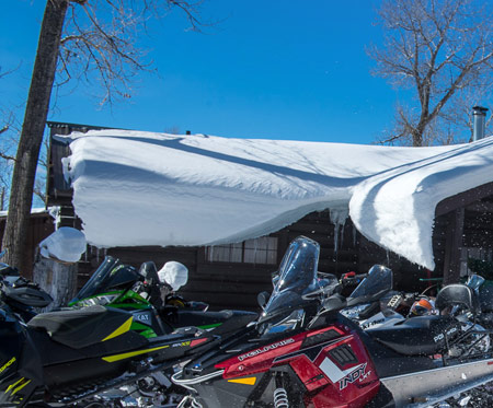 A young snowmobiler enjoying his day in the snow