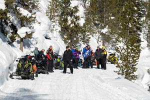 Snowmobilers in groups