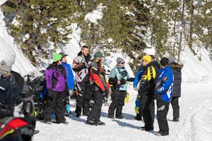 Snowmobilers in groups