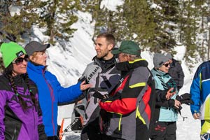 Snowmobilers in groups