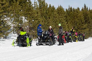 Snowmobilers in groups