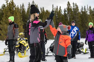 Snowmobilers in groups