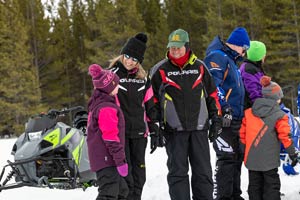 Snowmobilers in groups