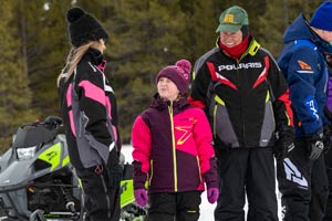 Snowmobilers in groups