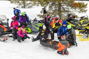 Snowmobilers in groups