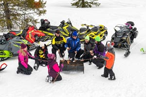 Snowmobilers in groups