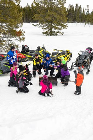 Snowmobilers in groups