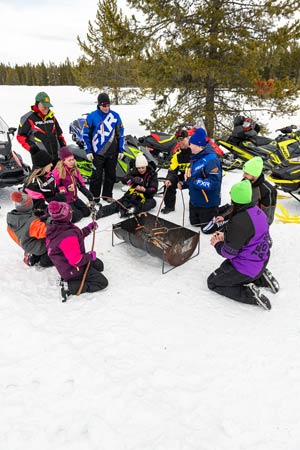 Snowmobilers in groups