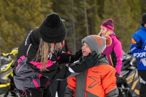 Snowmobilers in groups