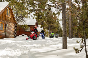 Snowmobilers riding on the trail