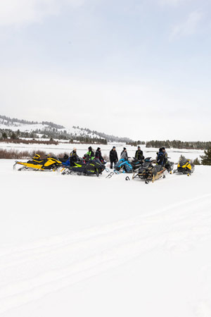 Photo of groups of snowmobilers