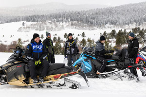 Photo of groups of snowmobilers