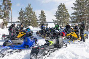 Photo of groups of snowmobilers