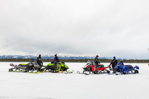 Photo of groups of snowmobilers