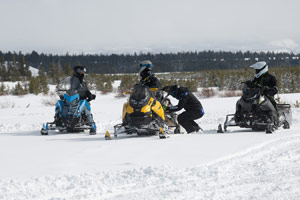 Photo of groups of snowmobilers