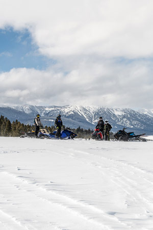 Photo of groups of snowmobilers