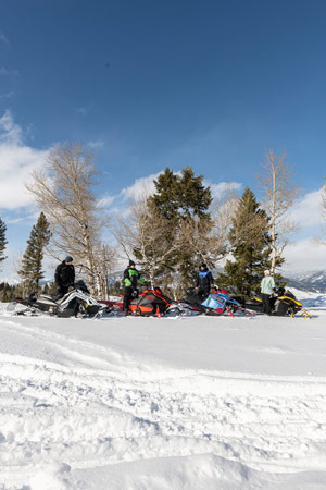 Photo of groups of snowmobilers