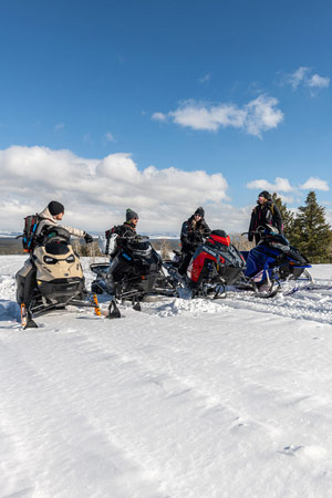 Photo of groups of snowmobilers