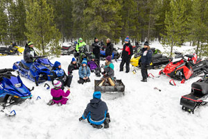 Photo of groups of snowmobilers