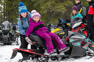 Photo of groups of snowmobilers